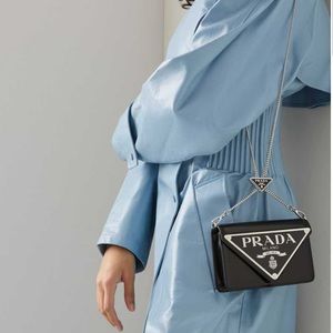 Prada leather shoulder bag with triangle logo detail, limited edition.